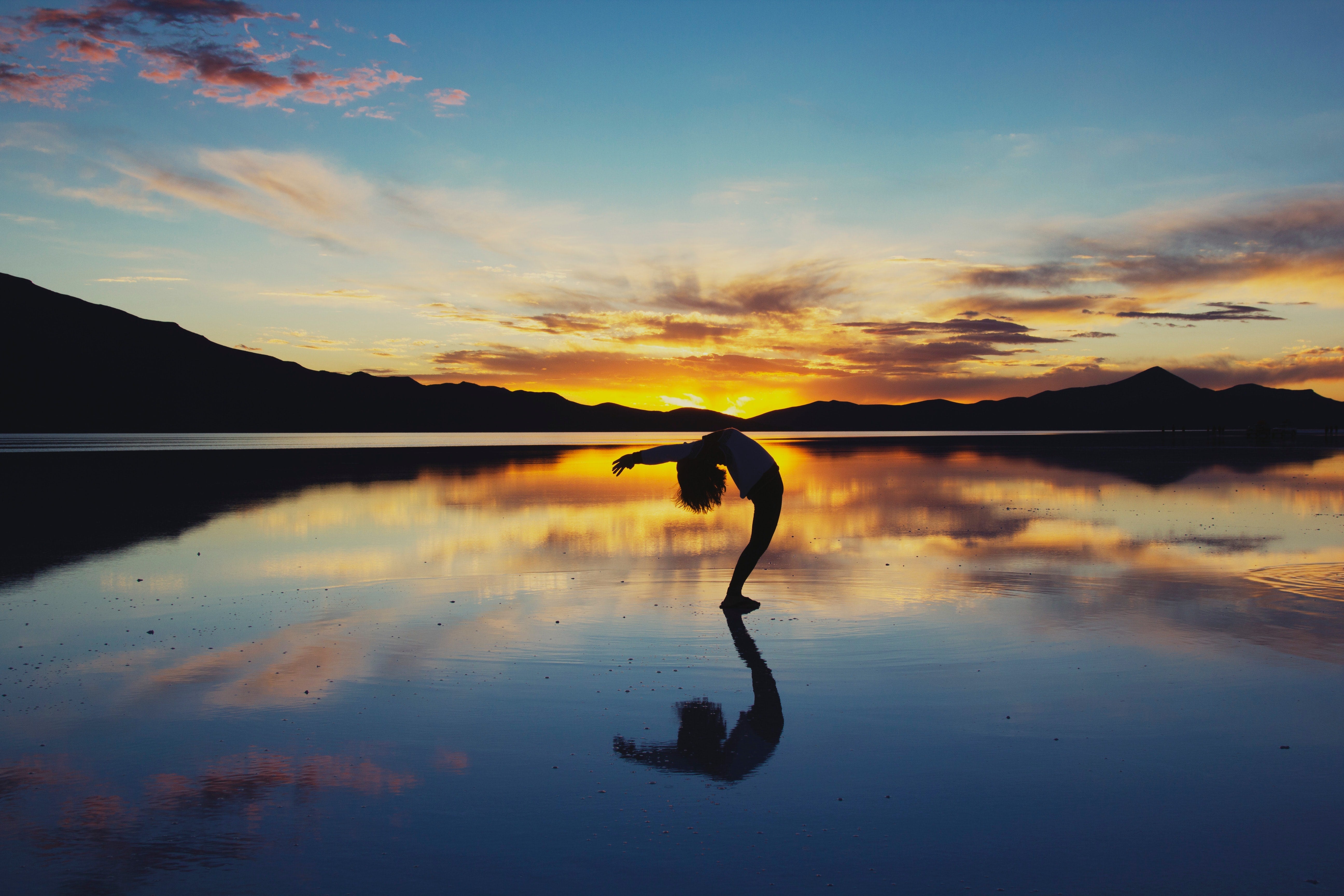 illustration of a women doing a yoga pose to help manage nausea symptoms from chemo